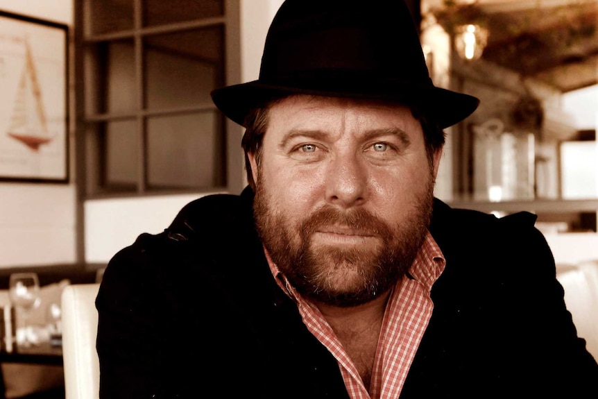 Photo of Shane Jacobson smiling