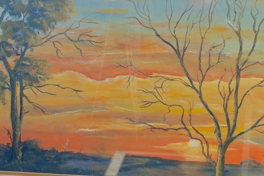 An oil painting of an orange sunset with trees in the foreground
