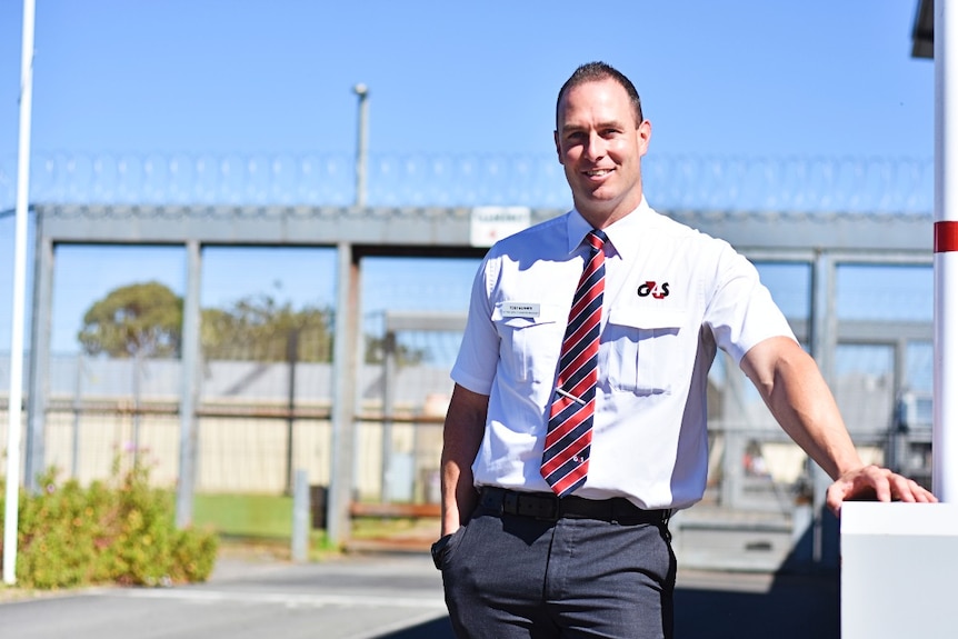 Correctional officer stands at the front of the Mount Gambier Prison.