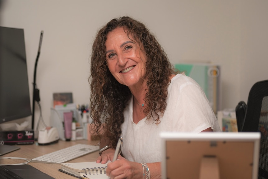 Driving instructor Ro Anne Steele working at her desk.