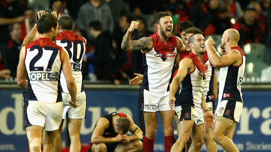 Drought broken ... Mitch Clark and the Demons celebrate their first win of 2012.