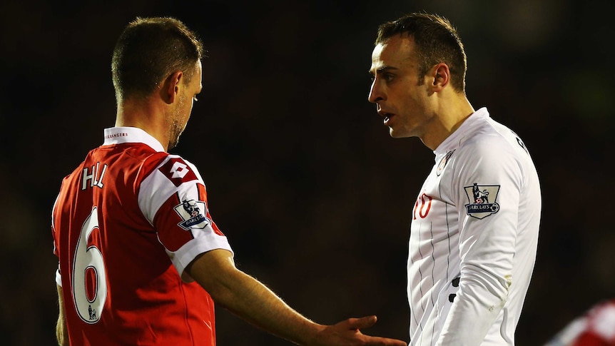 Difference of opinion ... Clint Hill (L) and Dimitar Berbatov face up to each other