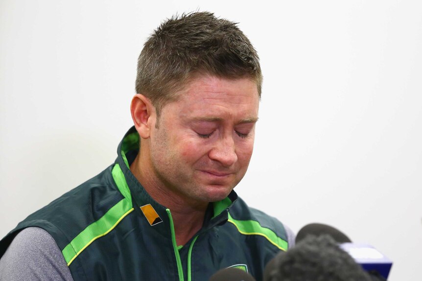 Michael Clarke pauses as he reads a statement in response to Phillip Hughes's death.