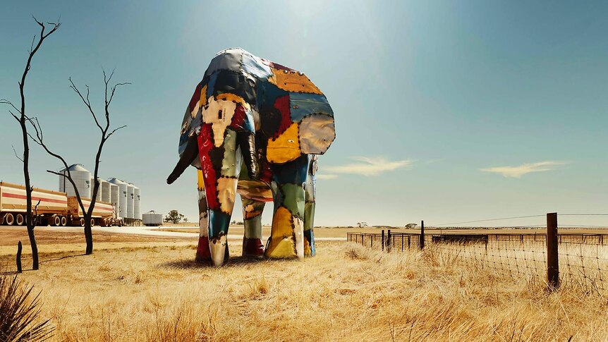 Elephant made out of crashed car parts next to a silo in the Wheatbelt