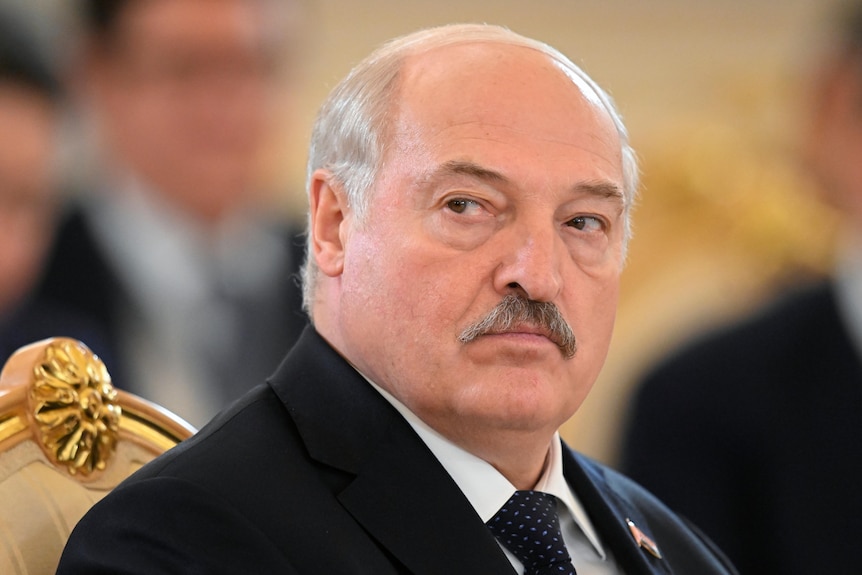 Lukashenko looking over his shoulder. 