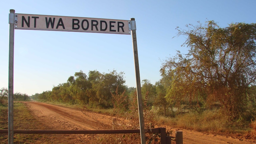 A street sign in a remote part of the outback on the WA and NT border.