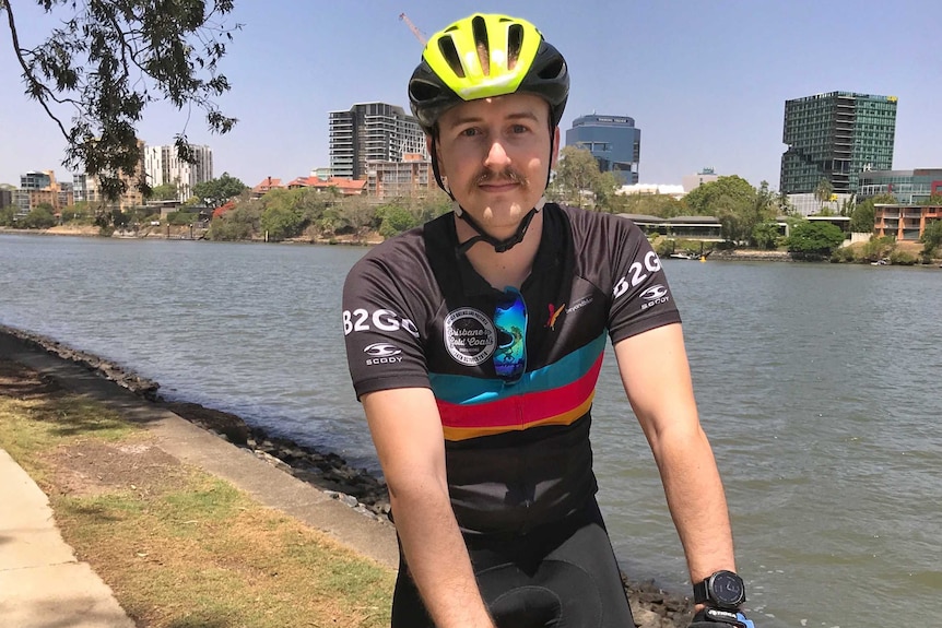 A man in cycling gear on his bike