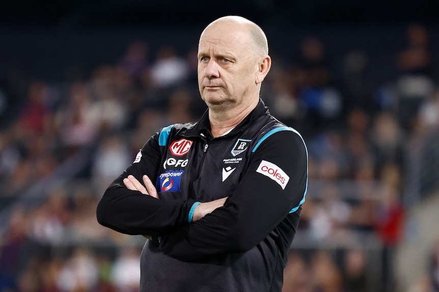 Port Adelaide coach Ken Hinkley with his arms folded.
