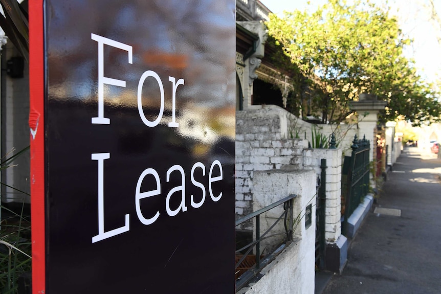 A For Lease sign advertising a rental property in Carlton North.