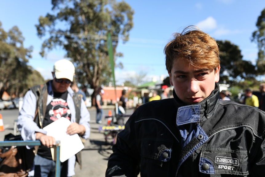 A close up of Sequani, 15 wearing his leather gear.