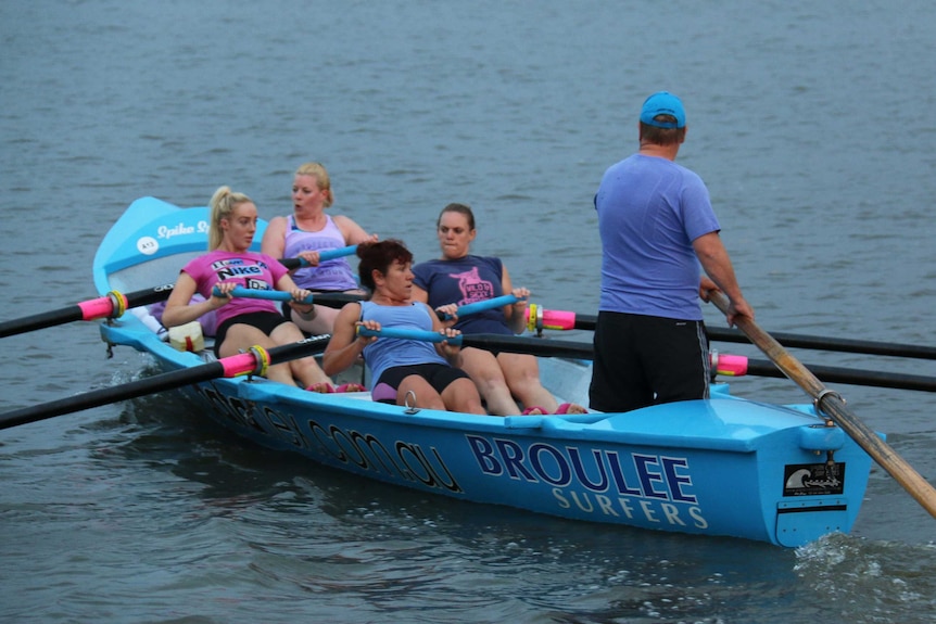Canberra-based Broulee Capitals rowing team training hard on Lake Burley Griffin.