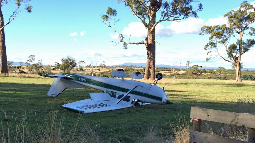 A light plane on its roof after crash landing at the Agfest agricultural show in northern Tasmania.