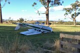 A light plane on its roof after crash landing at the Agfest agricultural show in northern Tasmania.