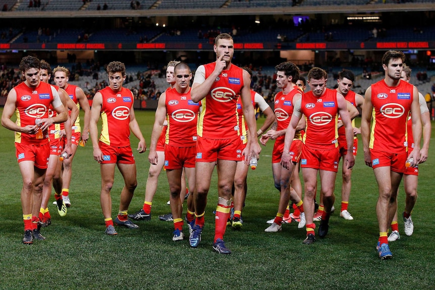 Suns players leave the field looking slightly dejected