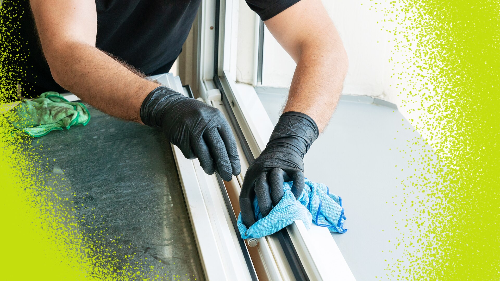 close up of man wearing gloves cleaning windowsills