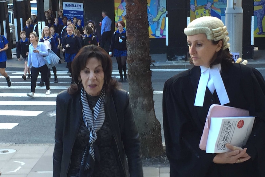 Two women walking outside a Sydney court