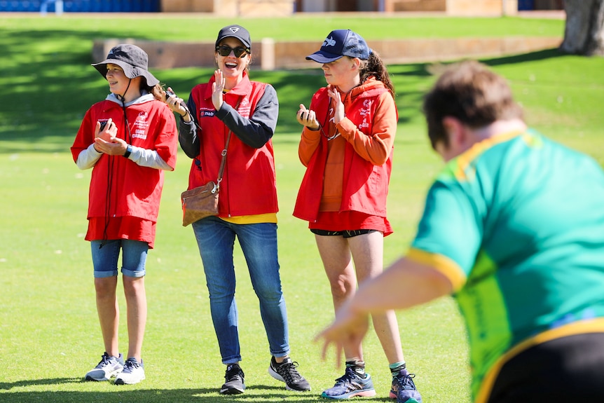 People cheer on Special Olympics competitors in Perth.