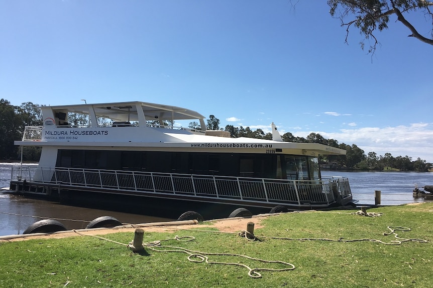 Houseboat, with top deck, at a marina on the Murray River in Mildura.