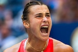 A Belarusian female tennis player pumps her left fist as she celebrates winning a point at the US Open.