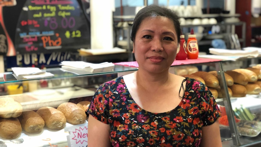 Thu Nguyet stands in front of the counter of her Adelaide store.