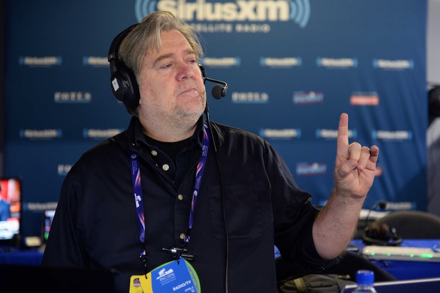 Stephen Bannon speaks into a headset while hosting a radio show.