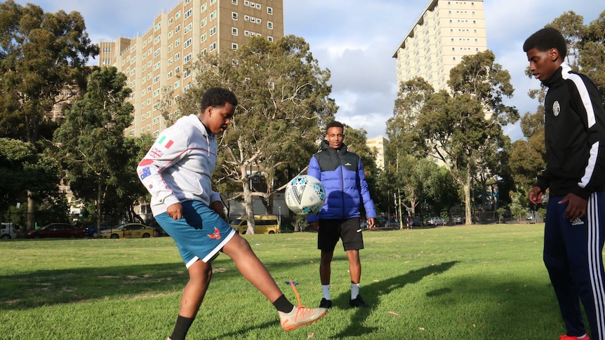 Young people take part in a football training session as part of the United Through Football community outreach program