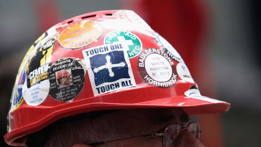An IR laws protestor wears a hard hat. (Getty Images: John Pryke)