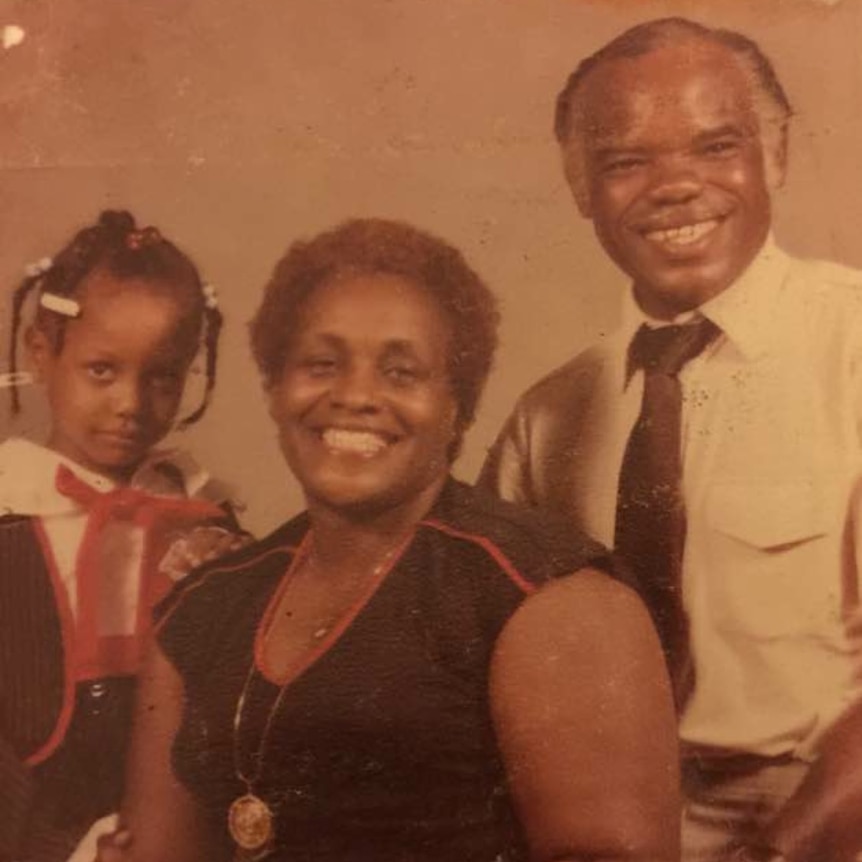 Child Tina, adult Morline and E.W. Higginbottom in family portrait and formal dress