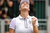 Ajla Tomljanovic rocks her head back, smiles and clenches her fist