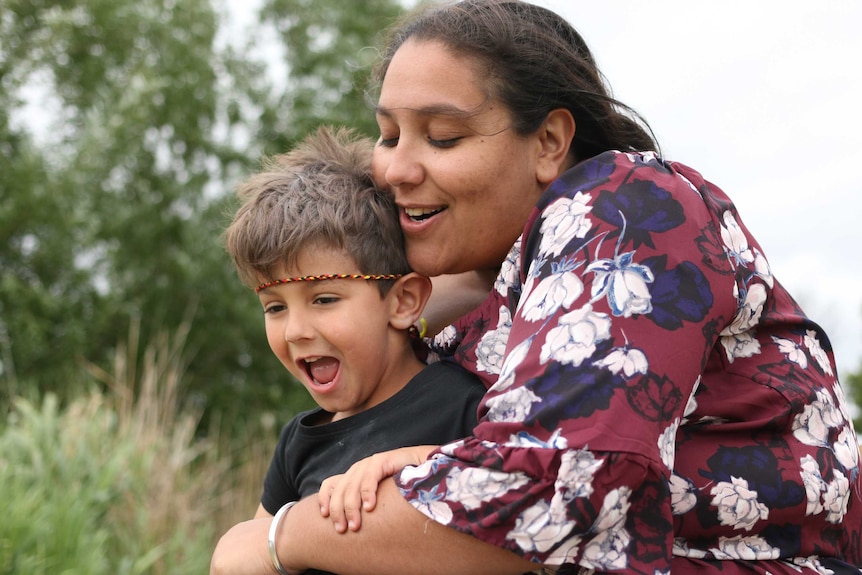 Jemima Balhas hugs her son Tobias.