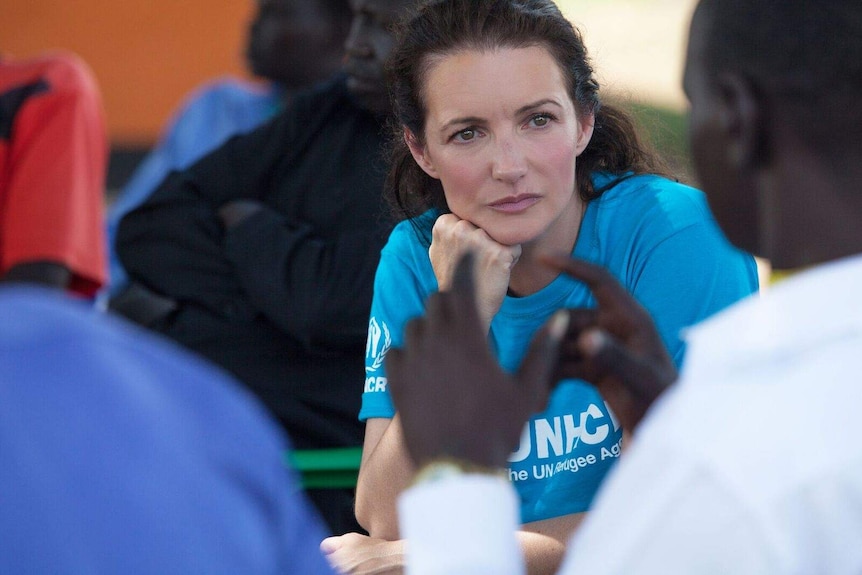 Actress and humanitarian Kristin Davis talking to refugees.