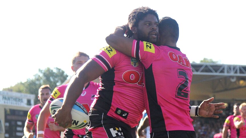 Jamal Idris of the Panthers is congratulated by team mate George Jennings