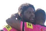 Jamal Idris of the Panthers is congratulated by team mate George Jennings