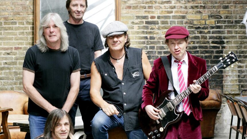 Phil Rudd with AC/DC band members