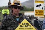 Brett Jacobs locked onto the gate at the AGL site near Gloucester.