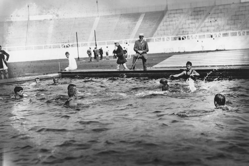 A black and white photo of water polo