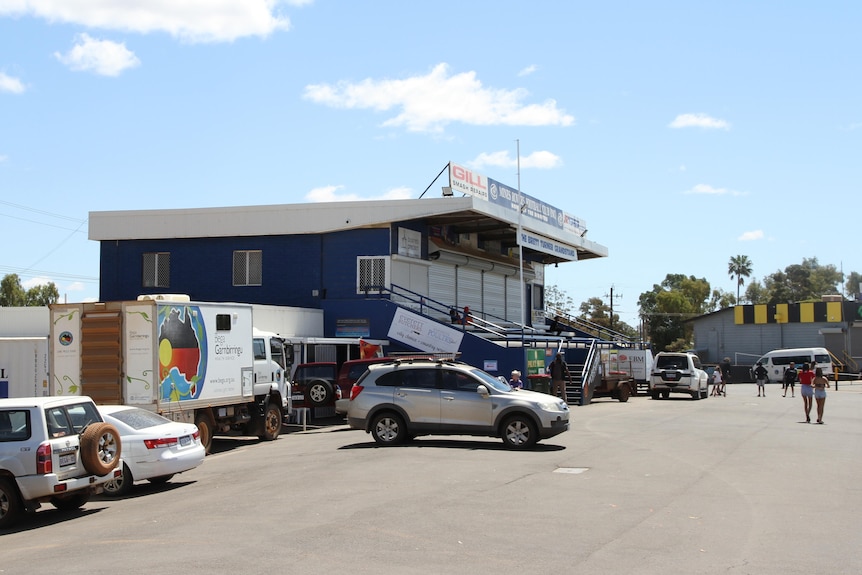 Cars in a car park outside a football oval on the Goldfields