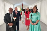 Justin Tkatchenko, his daughter, the PNG governor general and the governor-general's wife stand for a photo in formal wear. 