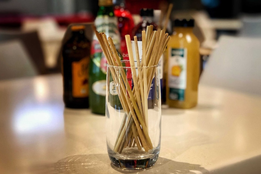 Rye drinking straws in a glass.