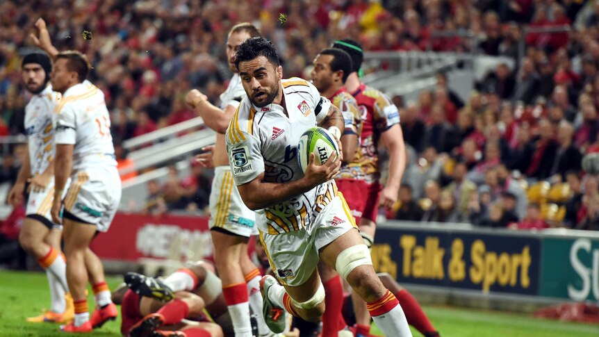 Liam Messam of the Waikato Chiefs runs over the try line