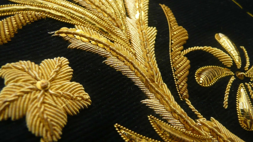 A close up of goldwork - beads and sequins.