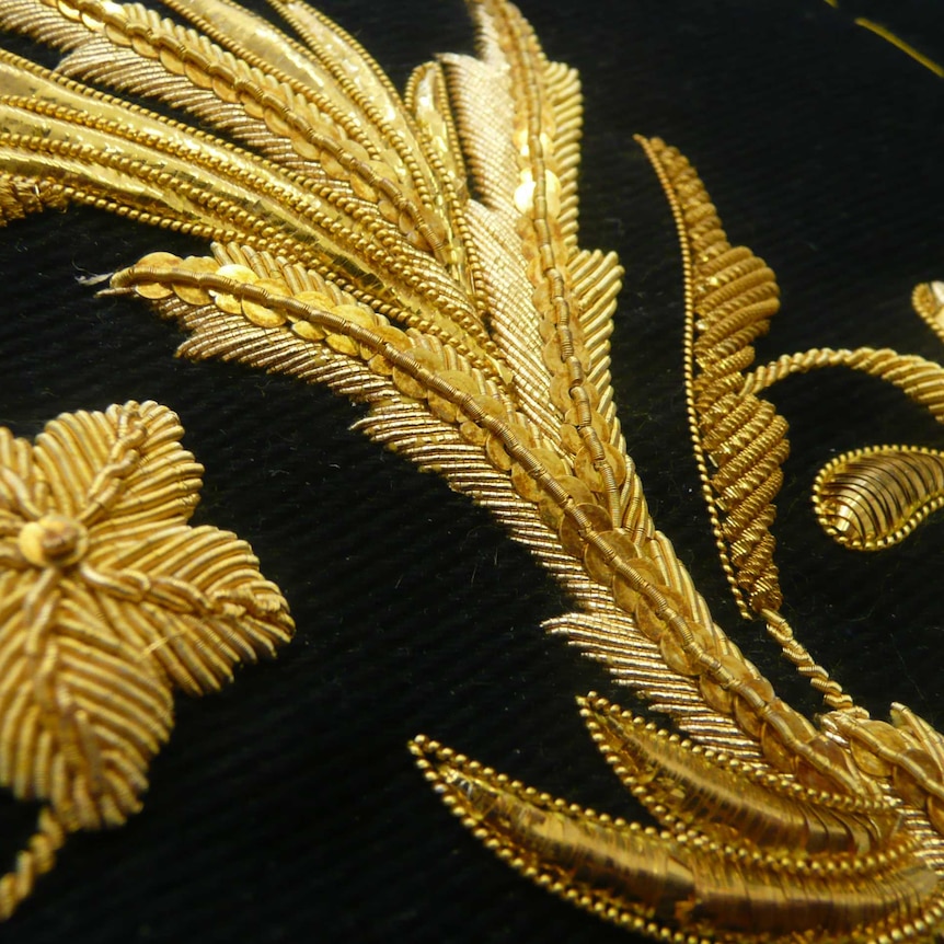 A close up of goldwork - beads and sequins.