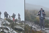 Hikers on a mountain as snow falls 