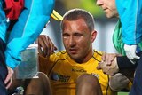 Ugly finish ... Quade Cooper is thought to have injured his ACL. (Getty: Sandra Mu)
