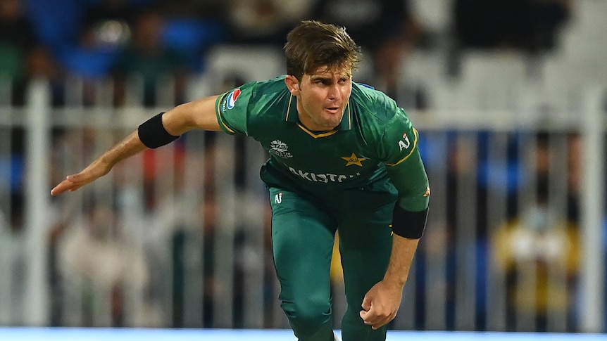 A Pakistan fast bowler is pictured mid-air in his follow through from a delivery at the T20 World Cup.