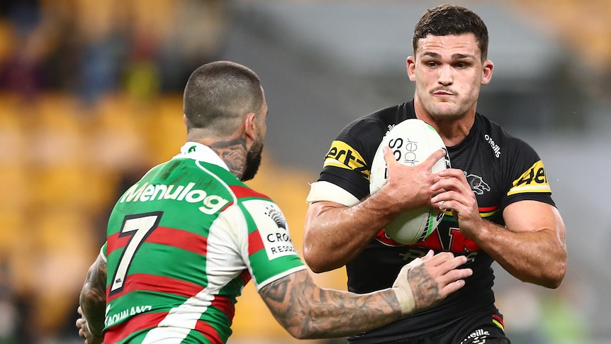 Rugby league player running the ball with a defender about to tackle him