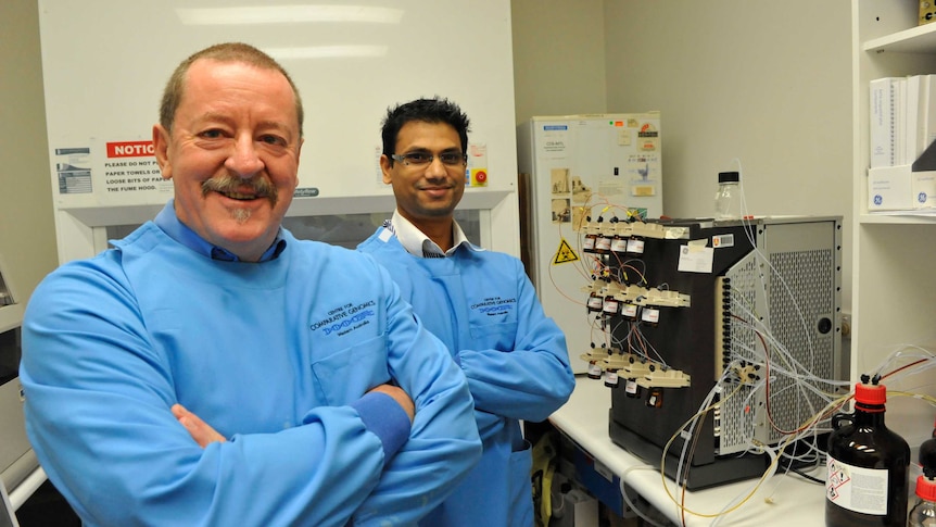 Professor Steve Wilton (left) and Dr Rakesh Veedu (rear) in a laboratory.