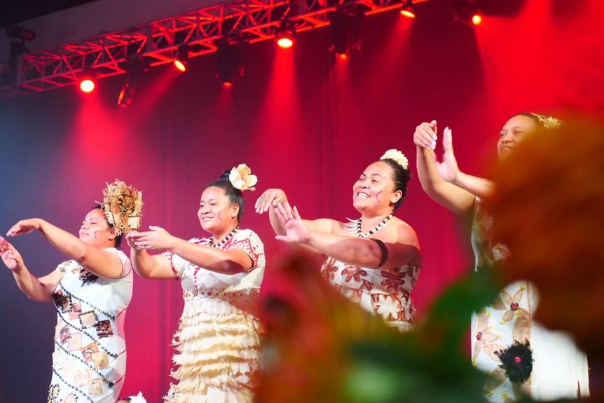 Samoan dancers perform onstage.