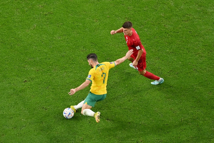 Mat Leckie prepares to shoot as a defender tries to approach