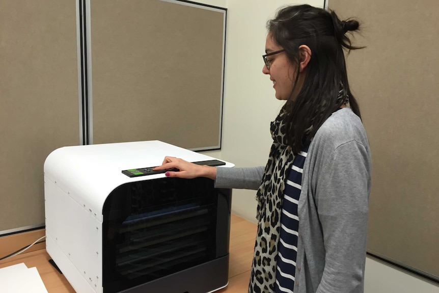 Librarian Lauren Fountain using the new Braille printer
